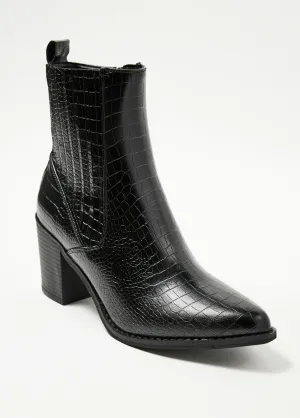 Reptile-style boots with pointed toe heels